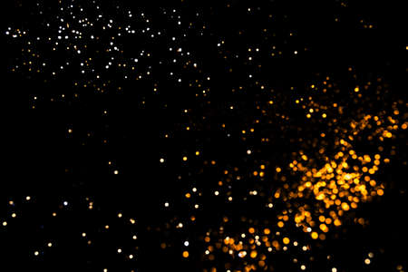 Gold abstract bokeh. Black background. Holyday conceptの写真素材
