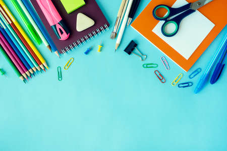 School supplies on blue background. Top view. Copy space.の写真素材