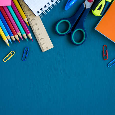 School supplies on blue background. Top view. Copy space.の写真素材