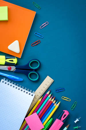 School supplies on blue background. Top view. Copy space.の写真素材