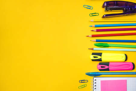 School supplies on yellow background. Top view. Copy space.の写真素材