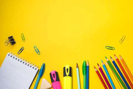School supplies on yellow background. Top view. Copy space.の写真素材