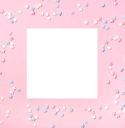 Little stars confetti on pink background. Holiday concept. Copy space for your text.の写真素材