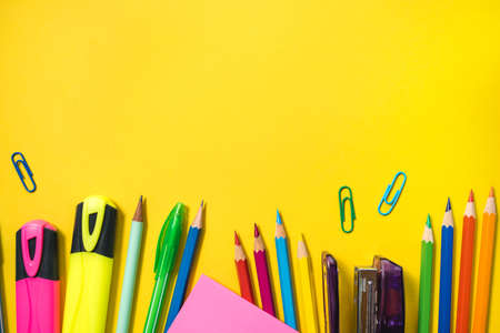 School supplies on yellow background. Top view. Copy space.の写真素材