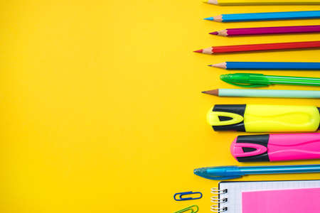 School supplies on yellow background. Top view. Copy space.の写真素材