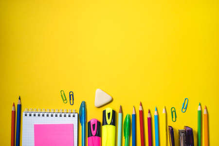 School supplies on yellow background. Top view. Copy space.の写真素材