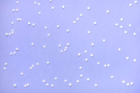 Little stars confetti on blue background. Holiday concept.の写真素材