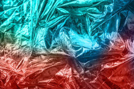 The texture of the crumpled fabric for your background. Trendy coral and blue colours. Place for your text.の写真素材