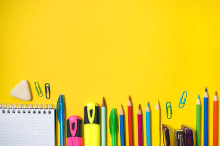 School supplies on yellow background. Top view. Copy space.の写真素材