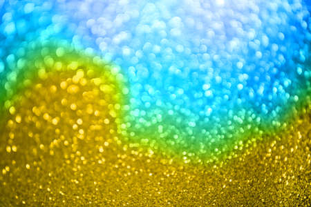 Gold glitter summer abstract background. Defocused sequin light.の写真素材