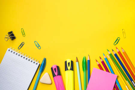 School supplies on yellow background. Top view. Copy space.の写真素材