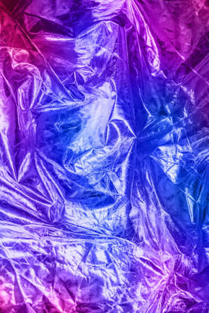The texture of the crumpled fabric for your background. Trendy neon colours. Place for your text.の写真素材