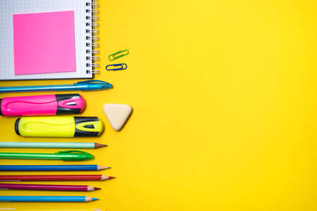 School supplies on yellow background. Top view. Copy space.の写真素材