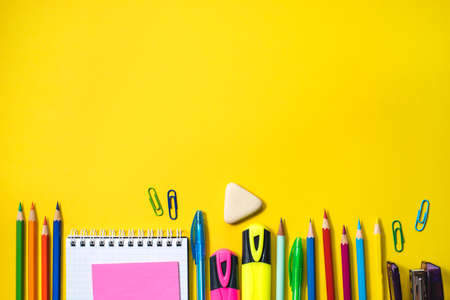 School supplies on yellow background. Top view. Copy space.の写真素材