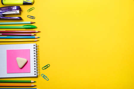 School supplies on yellow background. Top view. Copy space.の写真素材