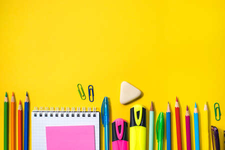 School supplies on yellow background. Top view. Copy space.の写真素材