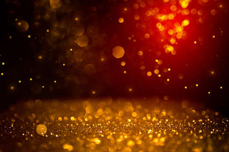 Golden abstract bokeh on black background. Holiday conceptの写真素材