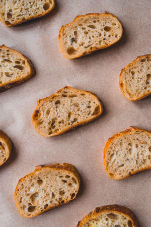Pattern with pieces of white bread on paper background. Top view.