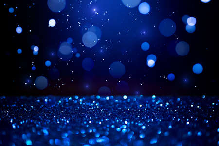 Blue abstract bokeh on dark background. Holiday conceptの写真素材