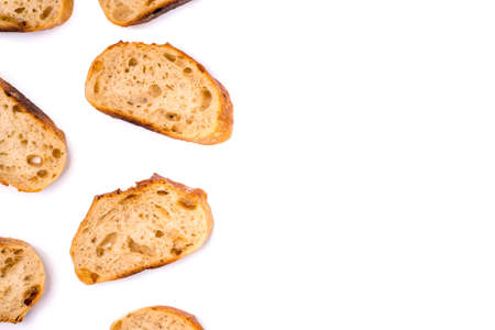 Frame of pieces of white bread isolated on white background. Flat lay, top view. Copy space for your text.の写真素材