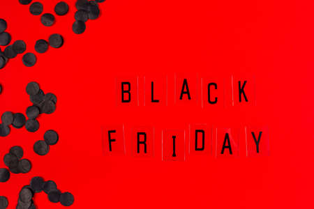 Black Friday sale tag on red background. Black Friday concept.の写真素材