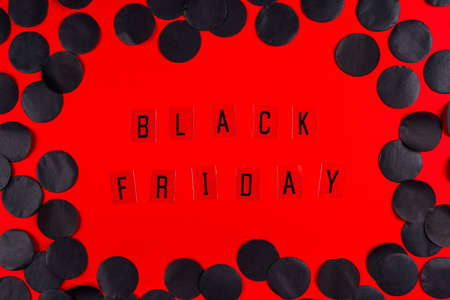 Black Friday sale tag on red background. Black Friday concept.の写真素材