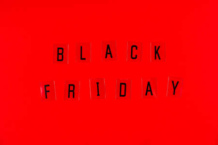 Black Friday sale tag on red background. Black Friday concept.の写真素材