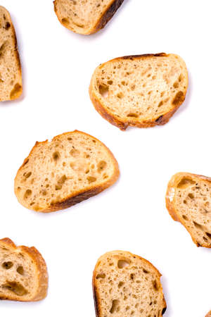 Pattern with pieces of white bread isolated on white background. Top view.の写真素材
