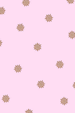 Winter pattern made of snowflakes and on pink background. Christmas concept. Flat lay.の写真素材