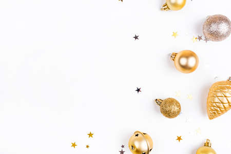 Festive white background with gold Christmas decorations. Flat lay, top view. Copy space for text.の写真素材