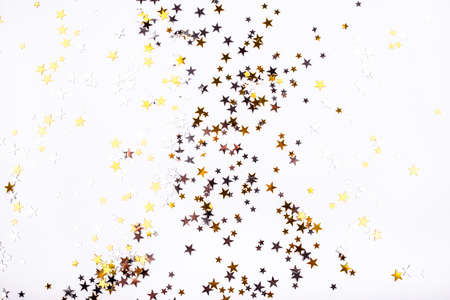 Golden and silver stars on white background. Flat lay, top view.の写真素材