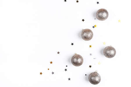 Festive white background with gold Christmas decorations. Flat lay, top view. Copy space for text.の写真素材