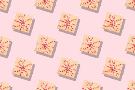 Pattern of Christmas gifts on pink background. Flat lay, top view.の写真素材