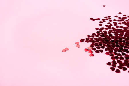 Pink background with red hearts. Valentine's day concept. Top view. Copy space for text.の写真素材