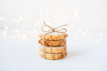 Stack of fresh cookies on white wooden table. Close up.の写真素材