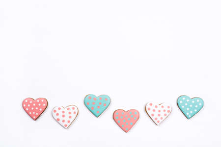 Gingerbread cookies with frosting in the shape of a heart. Valentines day concept. Flat lay, top view, copy space for text.の写真素材