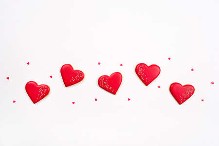 Gingerbread cookies with frosting in the shape of a heart. Valentines day concept. Flat lay, top view.の写真素材