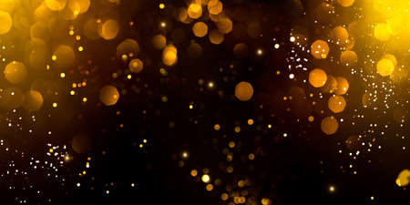 Golden abstract bokeh on black background. Holiday conceptの写真素材