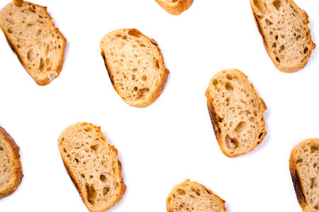 Pattern with pieces of white bread isolated on white background. Top view.の写真素材