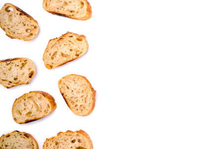 Frame of pieces of white bread isolated on white background. Flat lay, top view. Copy space for your text.の写真素材