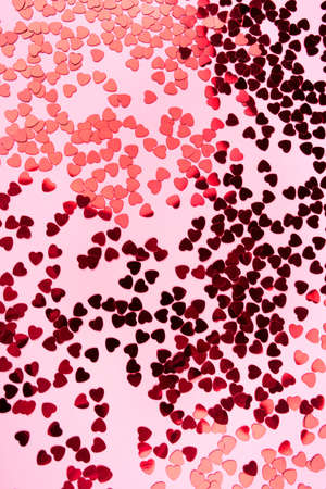 Pink background with red hearts. Valentines day concept. Top view.の写真素材