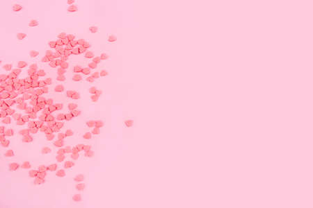 Pink background with tiny hearts. Valentines day concept. Top view.の写真素材