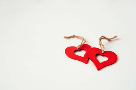 Valentines day decoration with ornaments in the form of hearts. White wooden background.の写真素材
