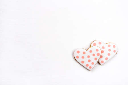 Gingerbread cookies with frosting in the shape of a heart. Valentines day concept. Flat lay, top view, copy space for text.の写真素材