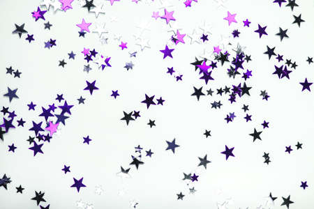 Purple and lilac stars on white background. Flat lay, top view.の写真素材