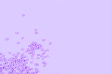 Lilac background with tiny hearts. Valentines day concept. Top view.の写真素材