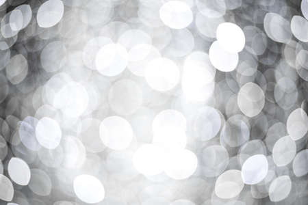 Abstract background with silver and white bokeh. Festive concept.の写真素材