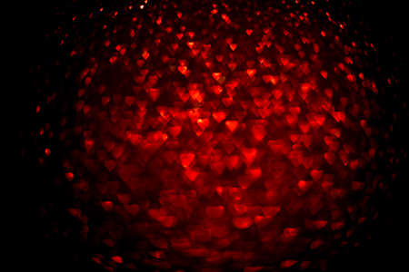 Background with red bokeh in the shape of a heart. Valentines day concept.の写真素材