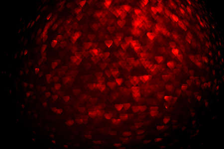 Background with red bokeh in the shape of a heart. Valentines day concept.の写真素材