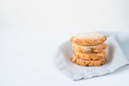 Stacked cookies on a linen napkin. Close up.の写真素材